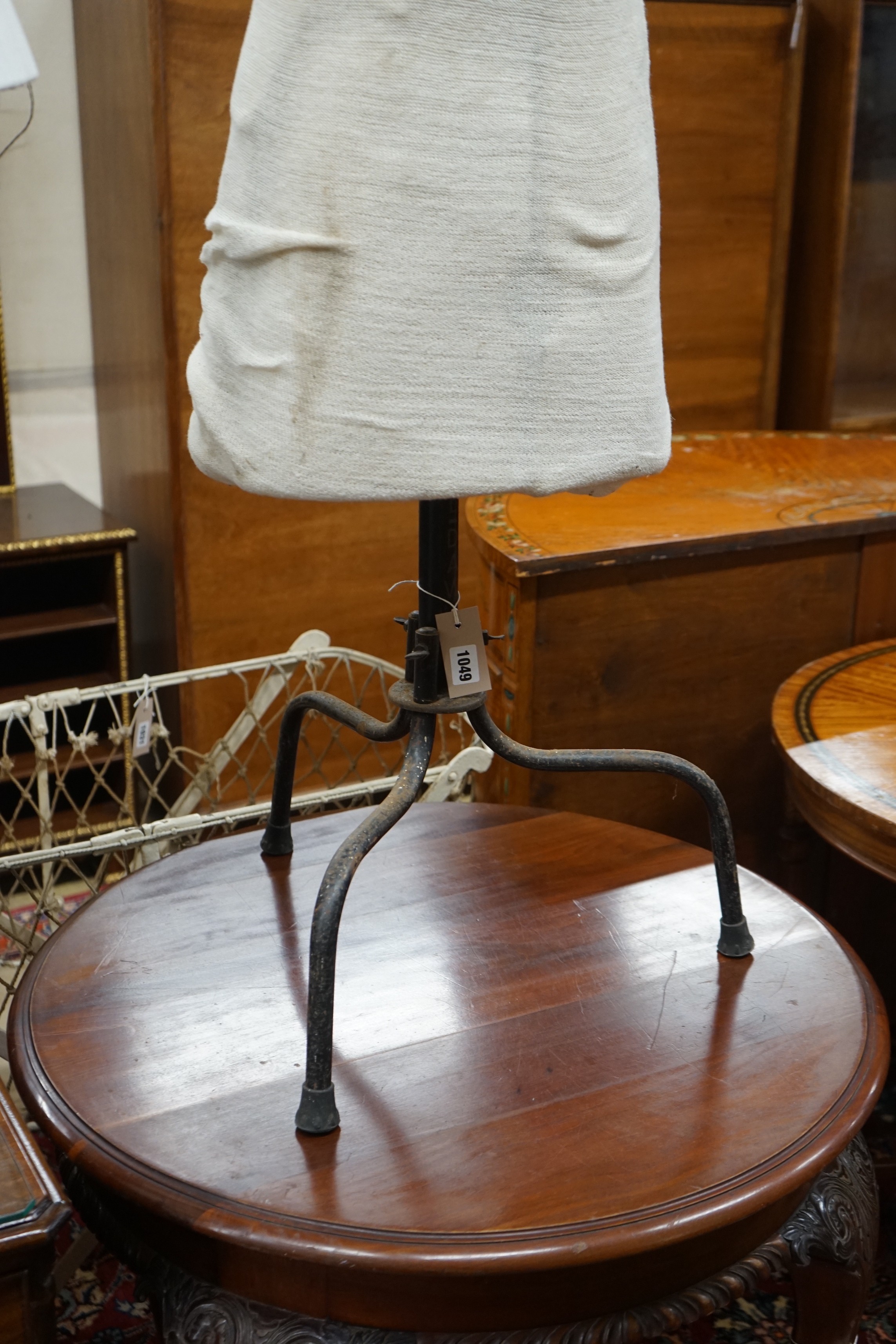 A tailor's dummy, marked 'Child' on wrought iron tripod stand, height 138cm